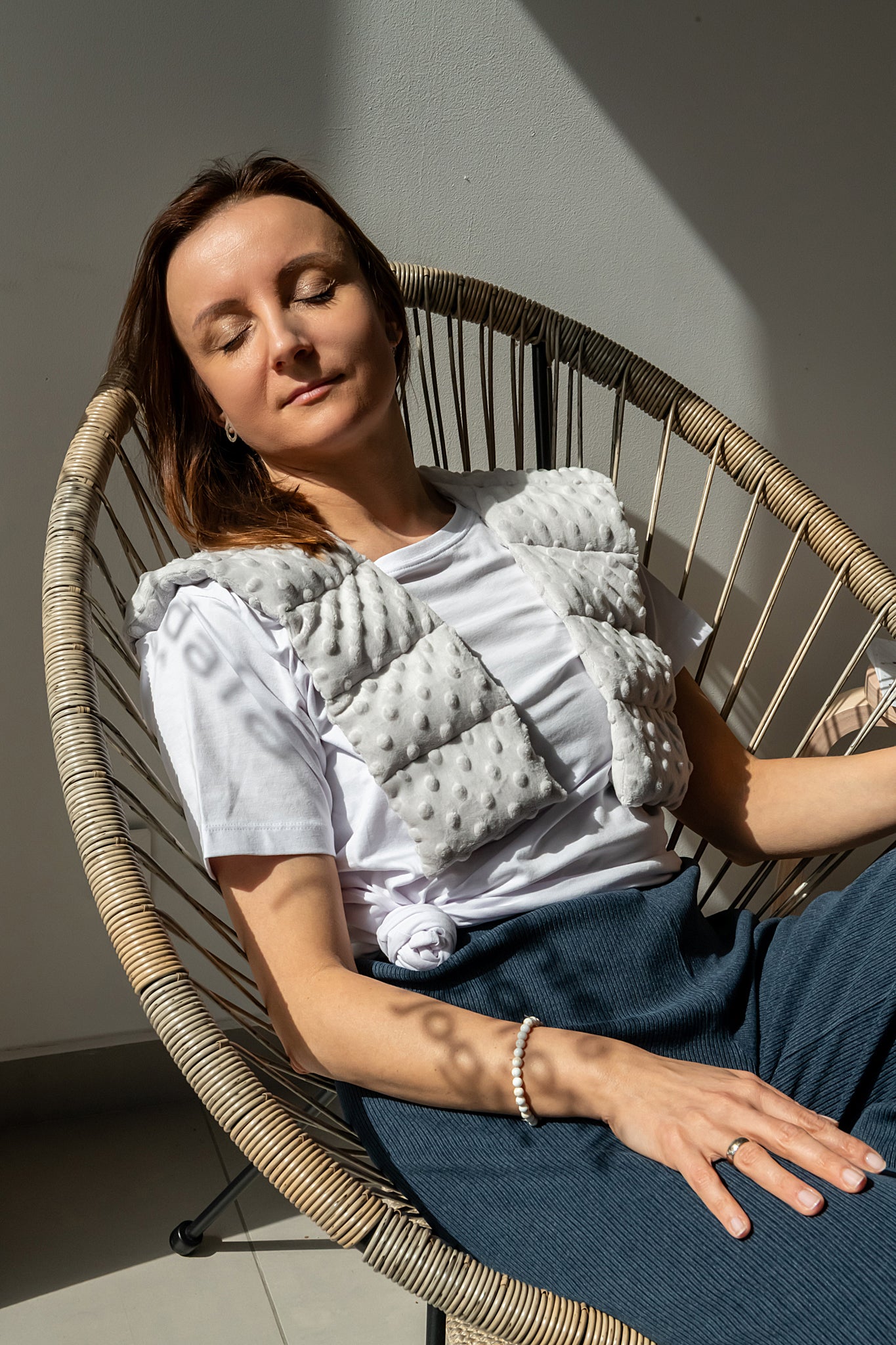 woman wearing long minky weighted collar in light grey shade made by sensory owl