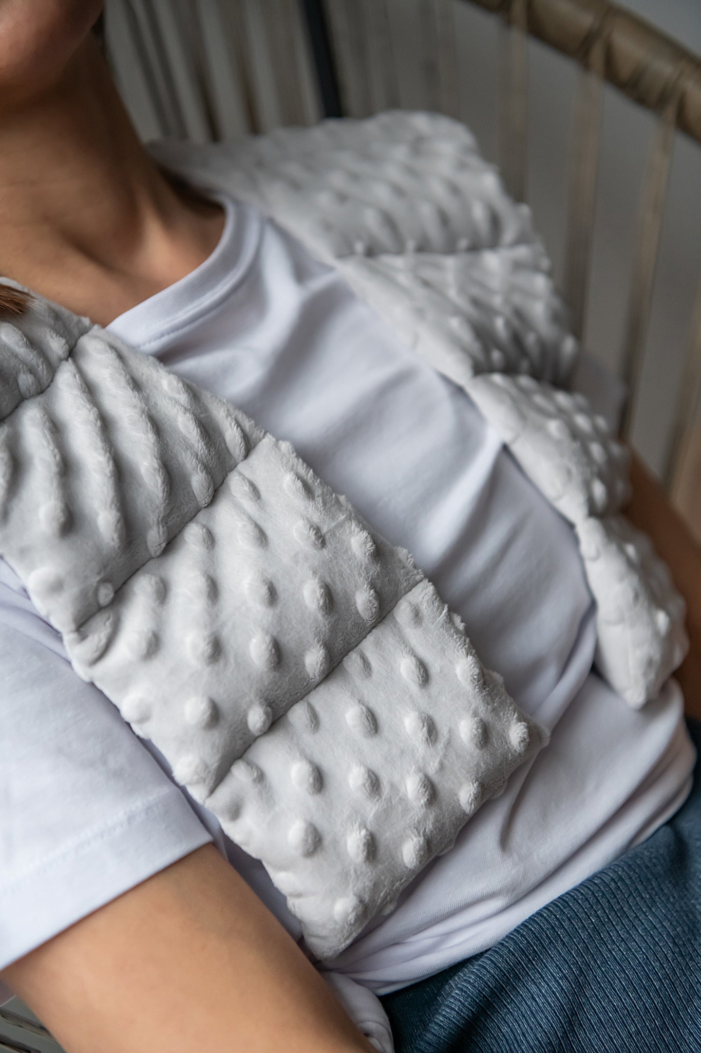 woman wearing long minky weighted collar in light grey shade made by sensory owl