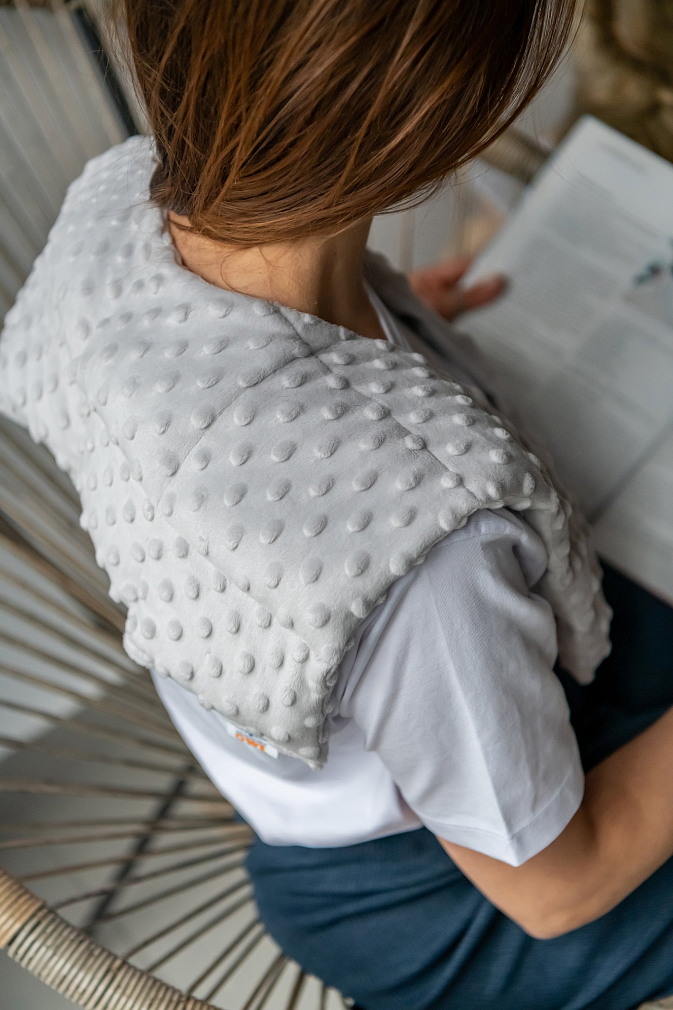 woman wearing long minky weighted collar in light grey shade made by sensory owl