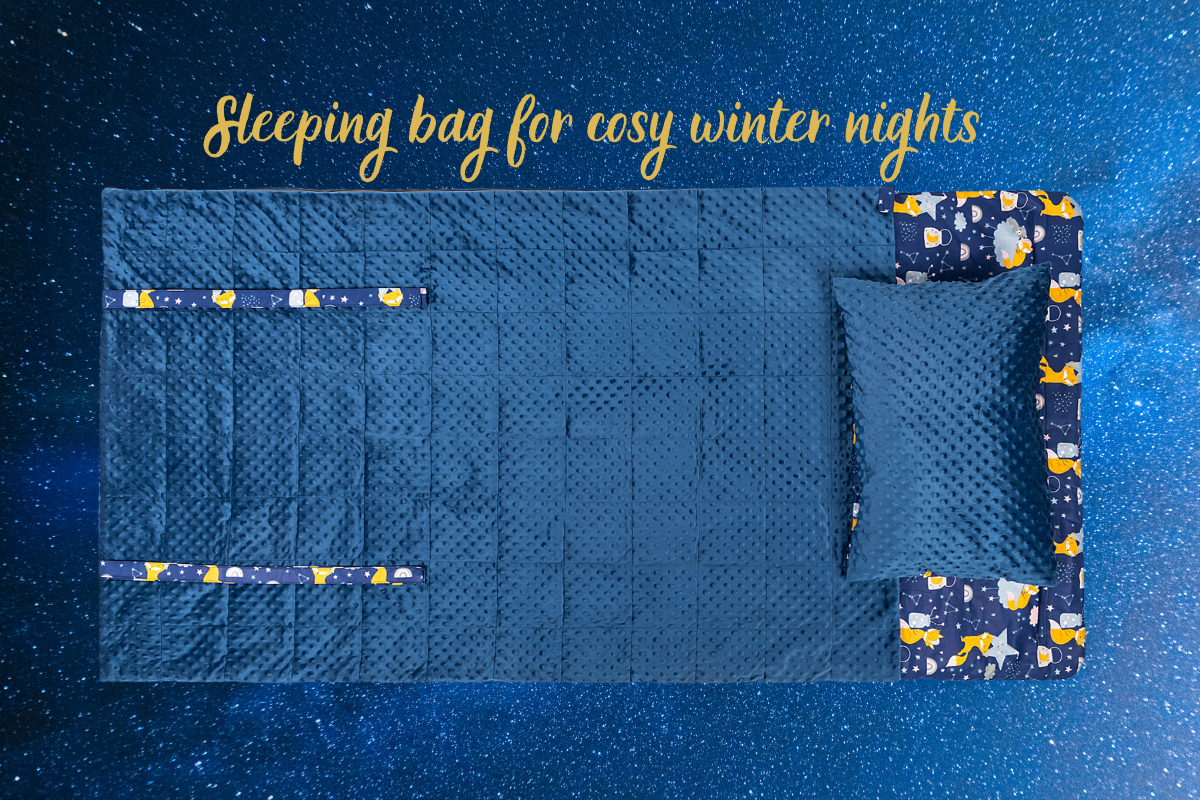 banner with the Weighted_sleeping_bag in navy blue plush and sleeping foxes