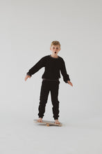 Laden Sie das Bild in den Galerie-Viewer, A BOY BALANCING ON THE GREY BALANCE BOARD / TRICK BOARD FOR KIDS- GOOD WOOD